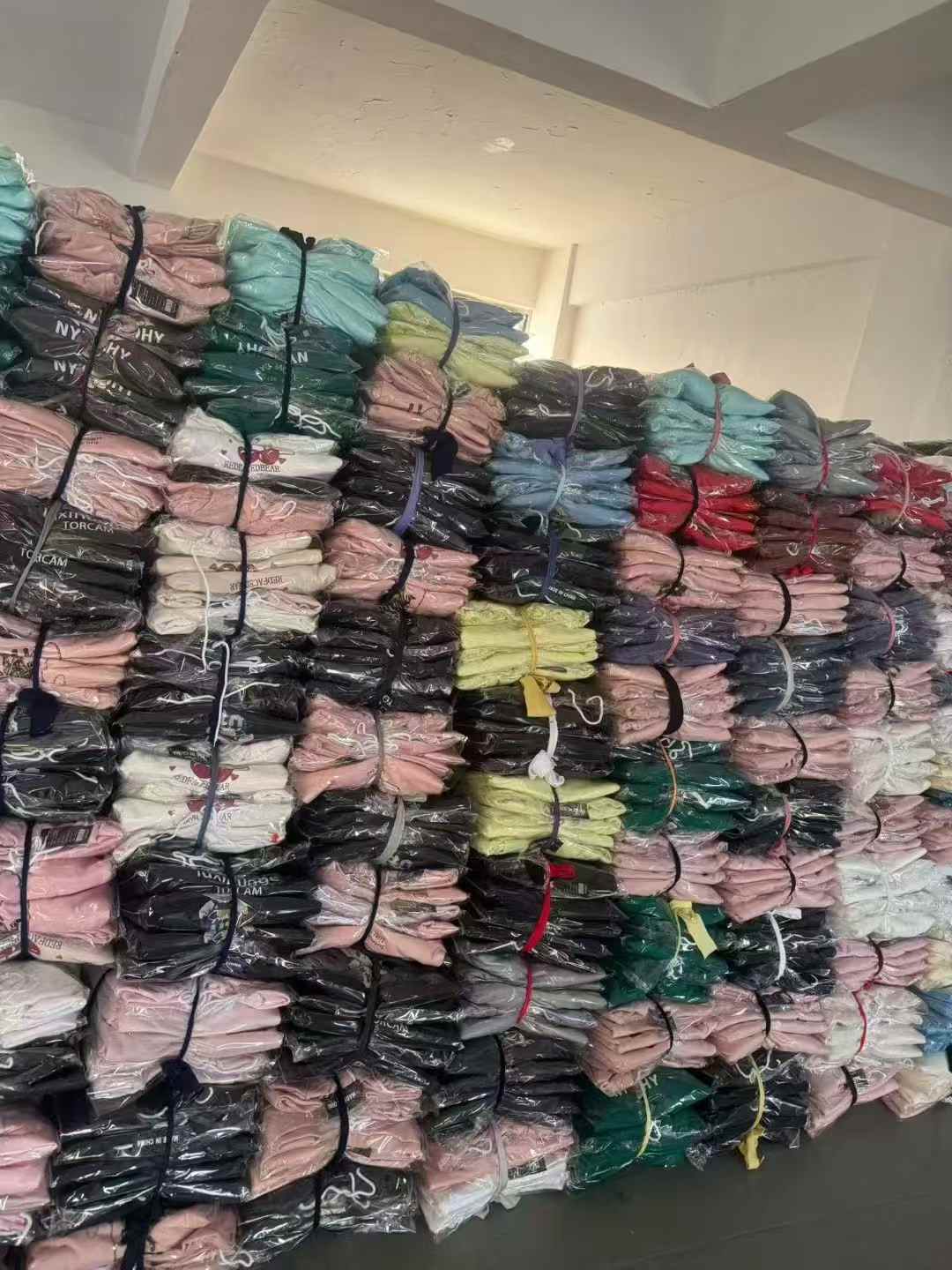 Stacked hoodies in bulk