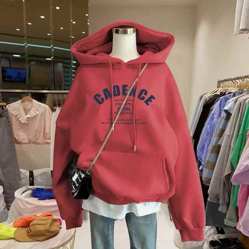 Model wearing a red hoodie