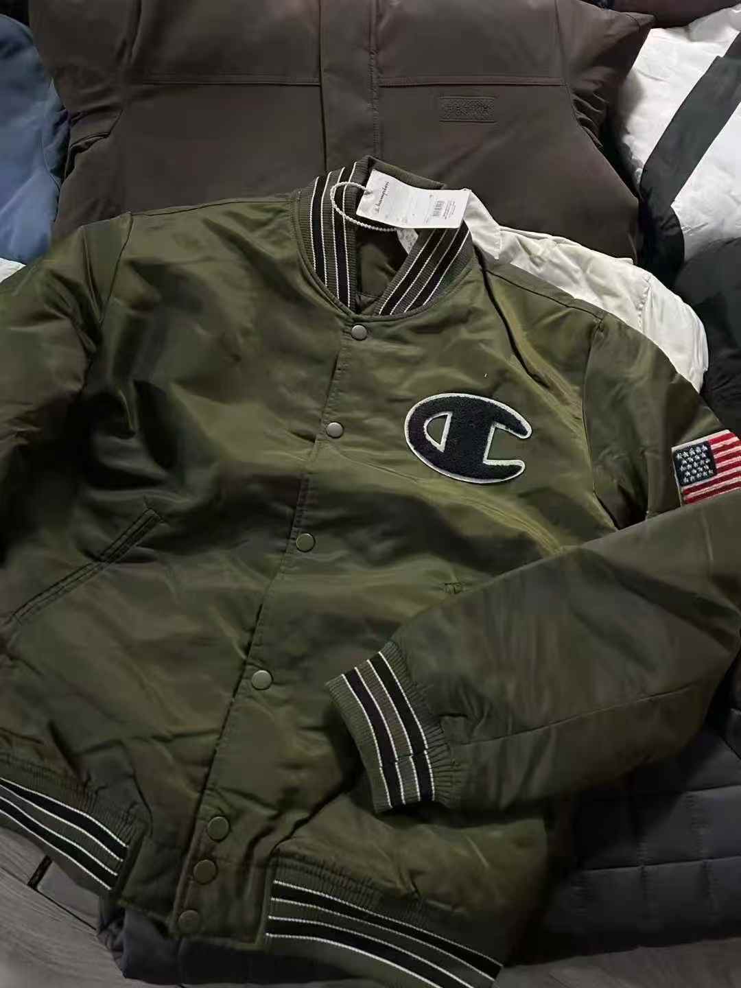 Army-green varsity jacket