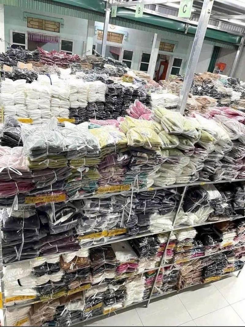 Warehouse shelves packed with bulk apparel
