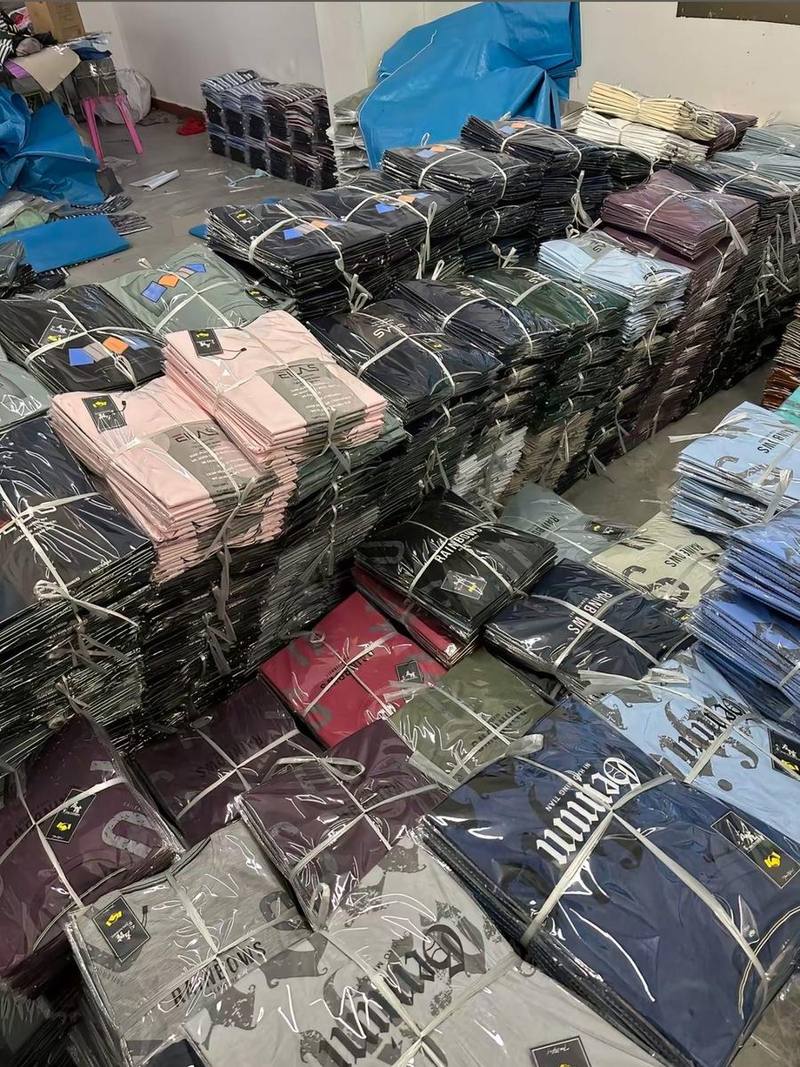 Stacks of folded wholesale garments ready to ship