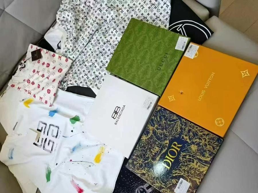 Premium branded T-shirts bulk flat lay