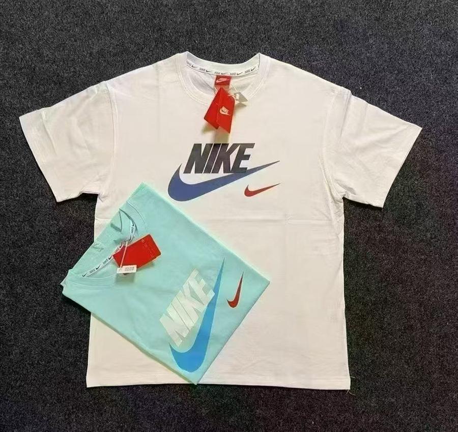 White and mint green Nike T-shirts