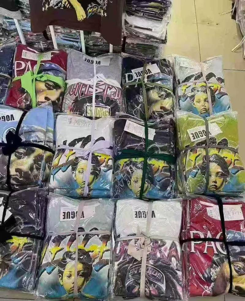 Bales of graphic T-shirts in stock
