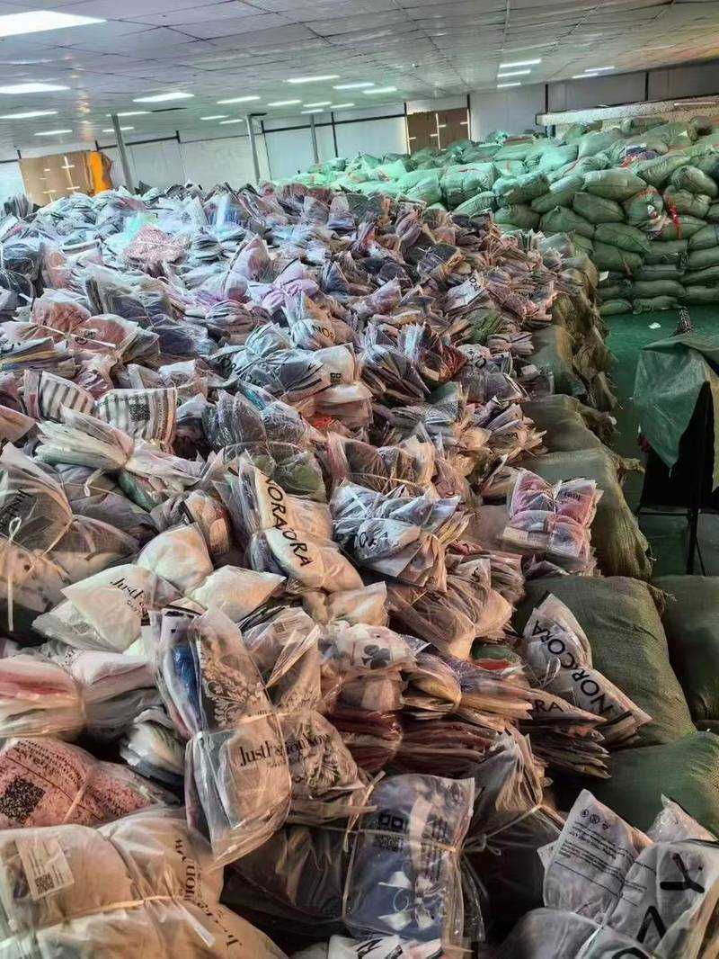 Endless rows of packaged clothes in stock
